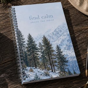 Tahoe snowy mountains notebook with pine trees and Sierra Nevada mountain landscape on a rustic wood table